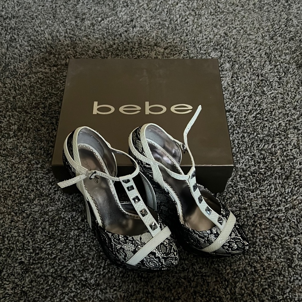 Size 8 Bebe Paula Black and white lace platform heels. Comes with box.